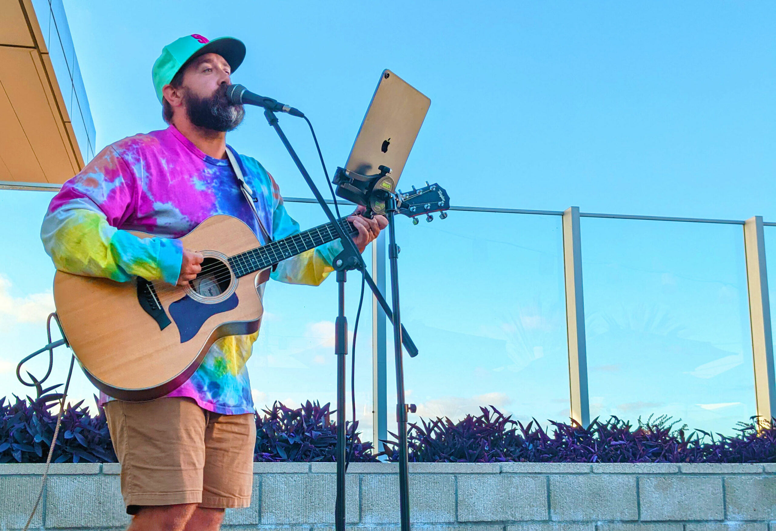 Lee Melton playing acoustic guitar